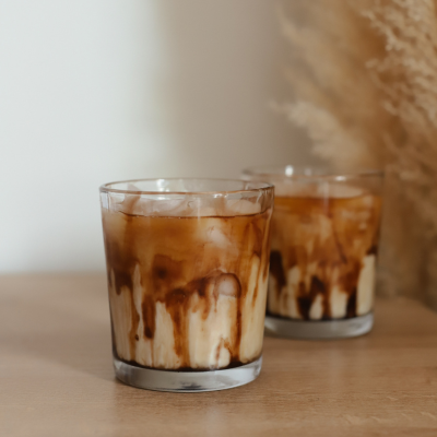 Iced coffee on a desk representing a calm, focused work session